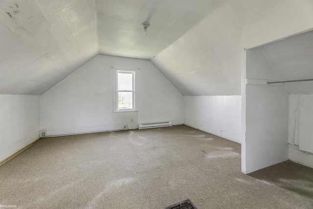 bonus room with carpet floors, baseboard heating, and vaulted ceiling