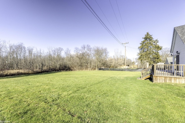 view of yard featuring a wooden deck