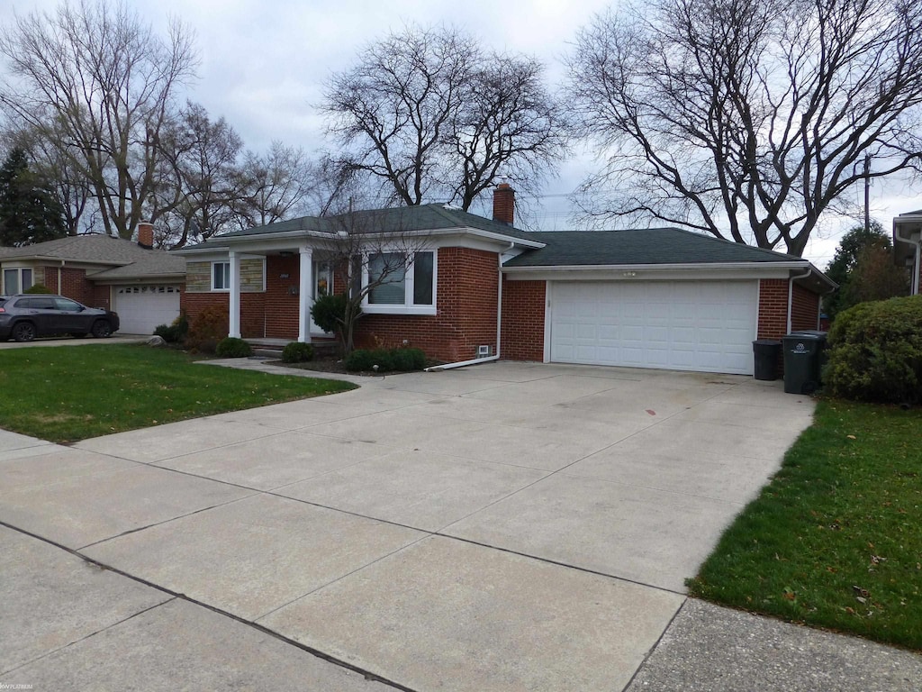 single story home with a front lawn and a garage