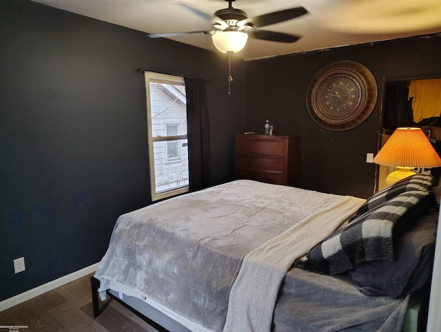 bedroom with hardwood / wood-style flooring and ceiling fan