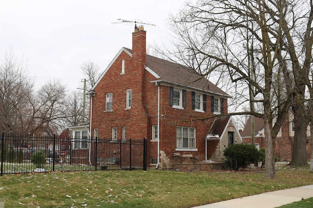 view of side of home featuring a lawn