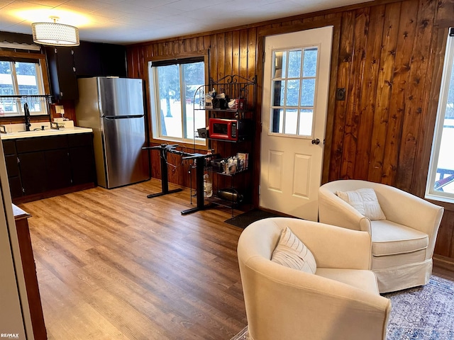 kitchen featuring plenty of natural light, light wood-type flooring, and stainless steel refrigerator