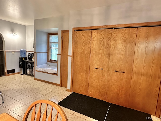 bathroom with tile patterned floors