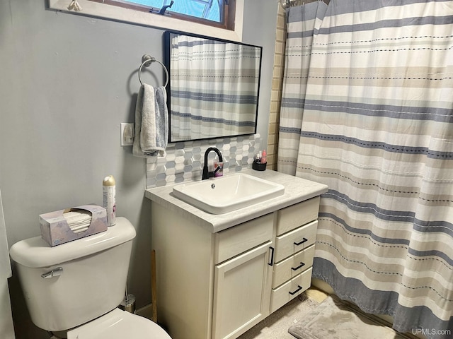 bathroom with backsplash and vanity