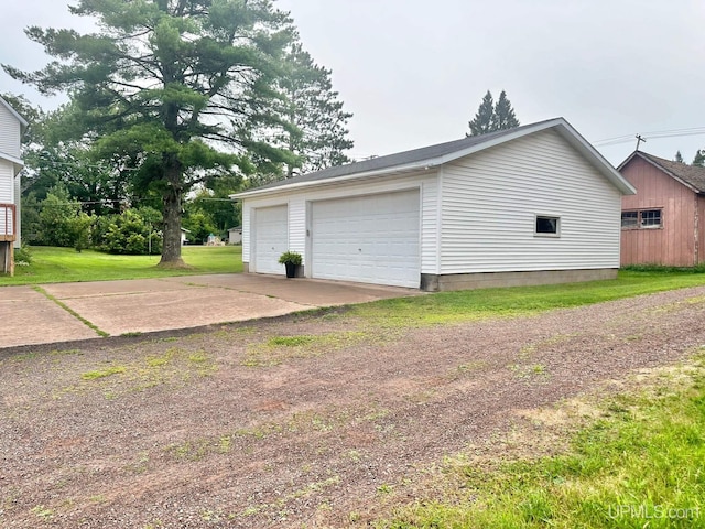 garage with a yard