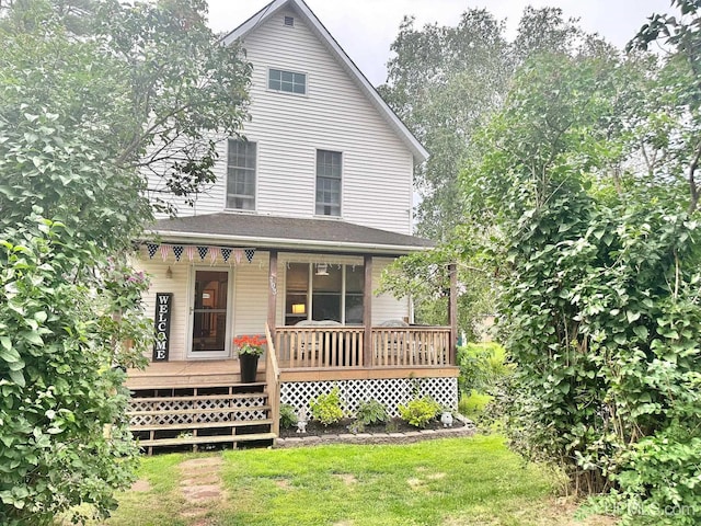 view of front facade with a porch and a front yard