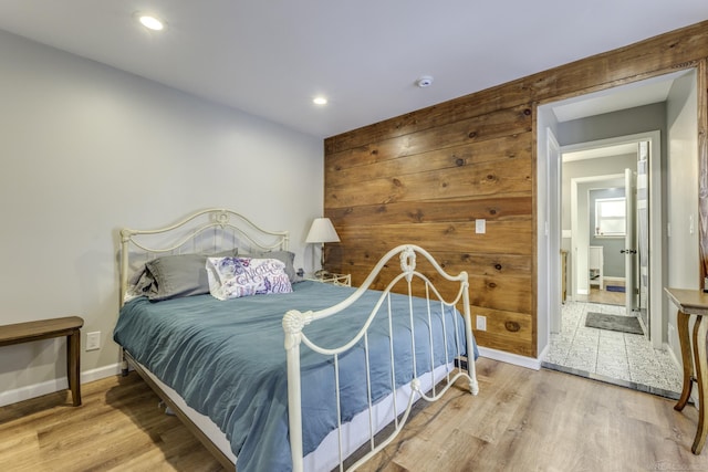 bedroom with hardwood / wood-style floors