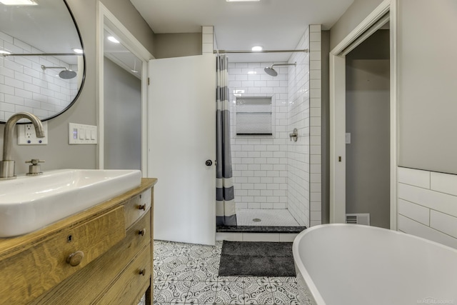 bathroom with tile patterned flooring, vanity, and curtained shower