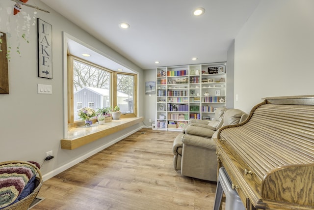 living area with light hardwood / wood-style flooring