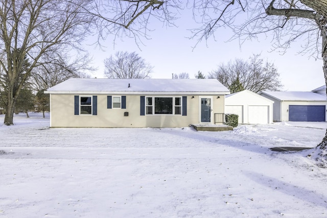 view of front facade featuring an outbuilding and a garage