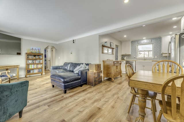 dining area featuring light wood-type flooring