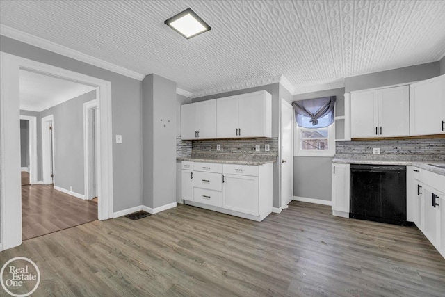 kitchen featuring crown molding, light wood-type flooring, white cabinetry, and black dishwasher