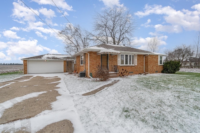 view of front of house with central AC and a garage