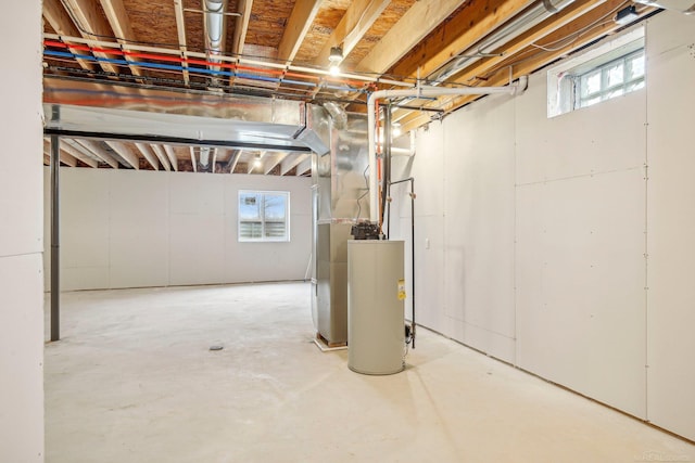 basement with a wealth of natural light and water heater