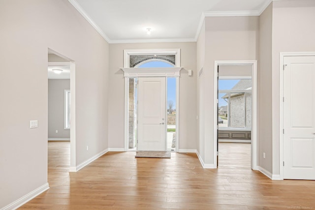 entryway featuring crown molding and light wood-type flooring