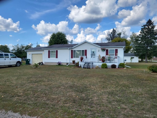 ranch-style home with a garage and a front lawn