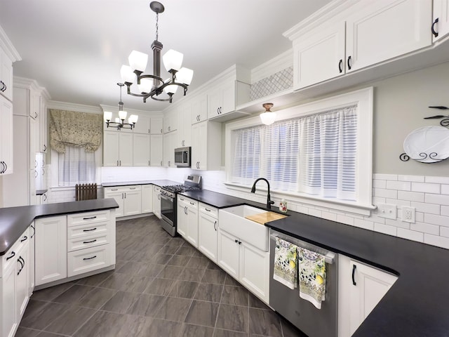 kitchen with white cabinetry, pendant lighting, stainless steel appliances, and sink