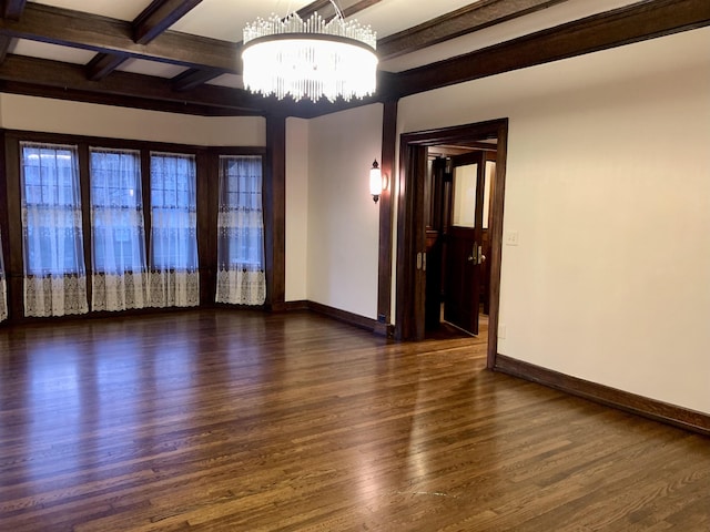 unfurnished room featuring a chandelier, dark hardwood / wood-style flooring, beamed ceiling, and coffered ceiling