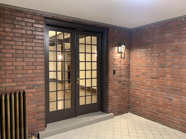 doorway to property with radiator heating unit and french doors