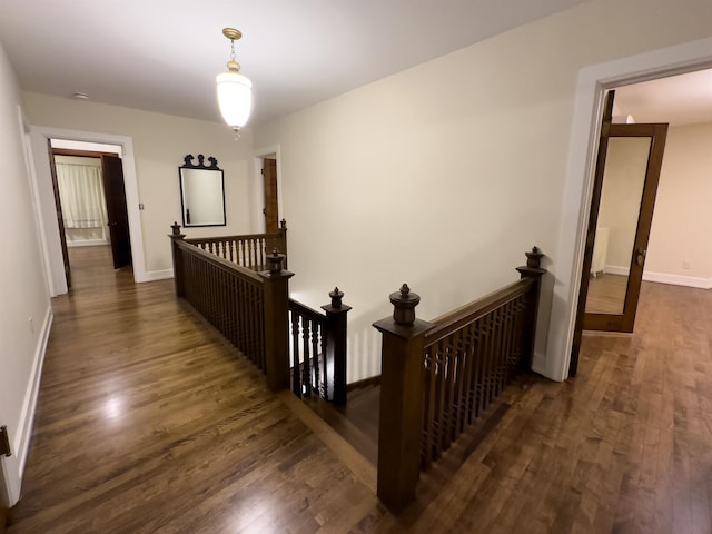 hallway featuring dark hardwood / wood-style flooring