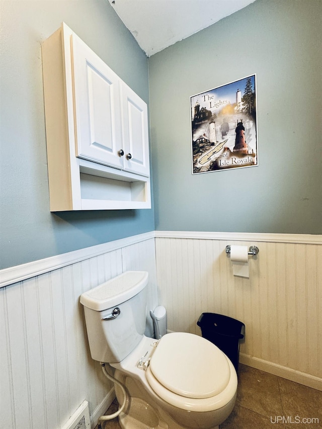 bathroom with tile patterned floors and toilet