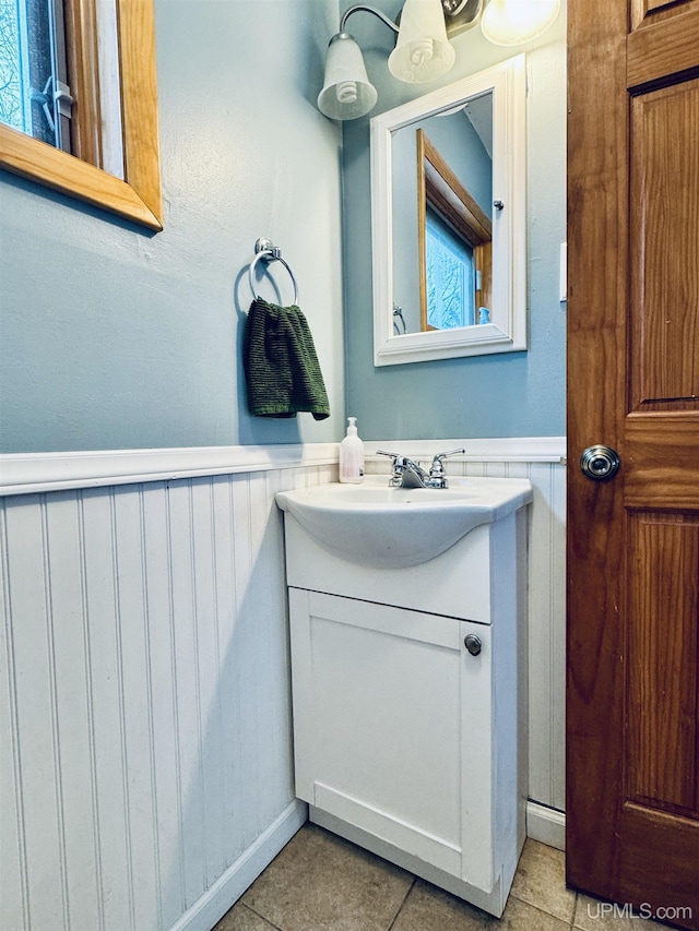 bathroom with tile patterned flooring and vanity