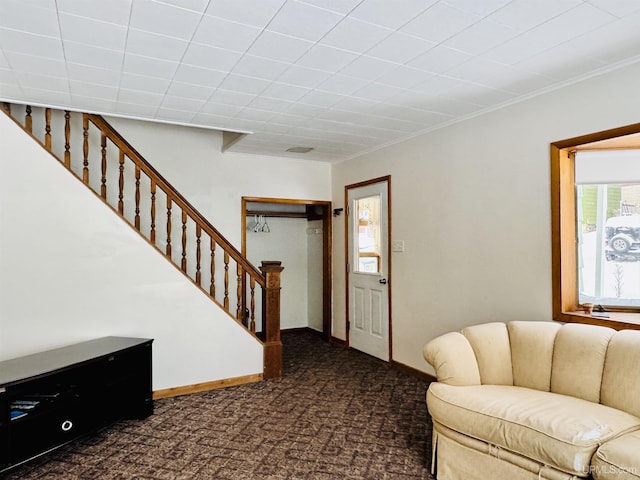 living room featuring dark colored carpet