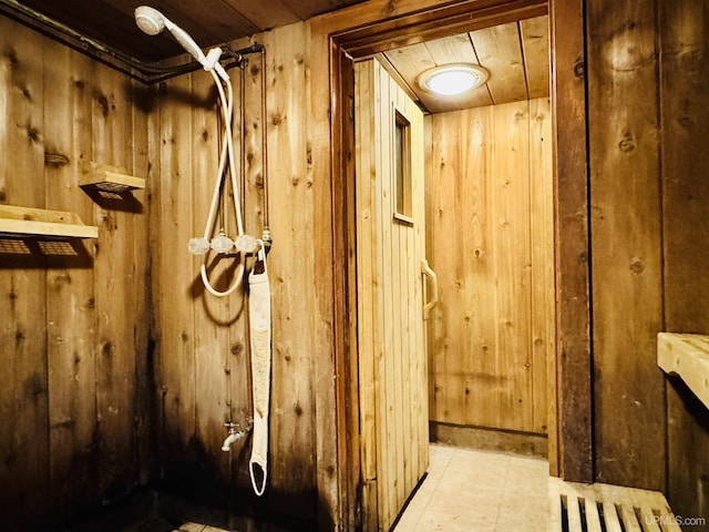 bathroom featuring wood walls