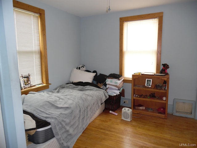 bedroom with light hardwood / wood-style floors