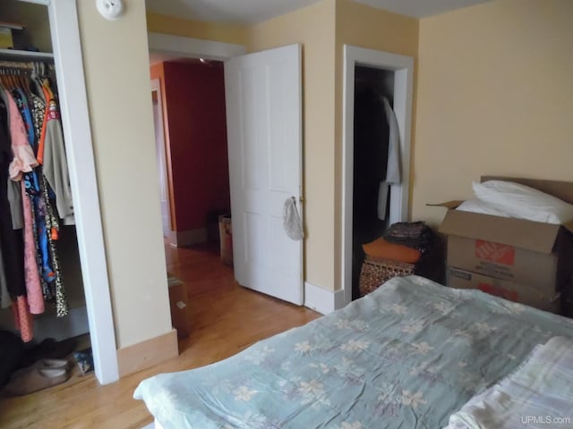 bedroom featuring light hardwood / wood-style flooring and a closet