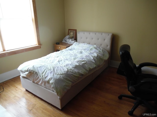 bedroom featuring hardwood / wood-style flooring