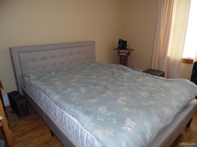 bedroom with wood-type flooring