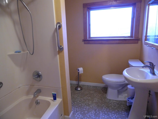 bathroom featuring toilet and tub / shower combination