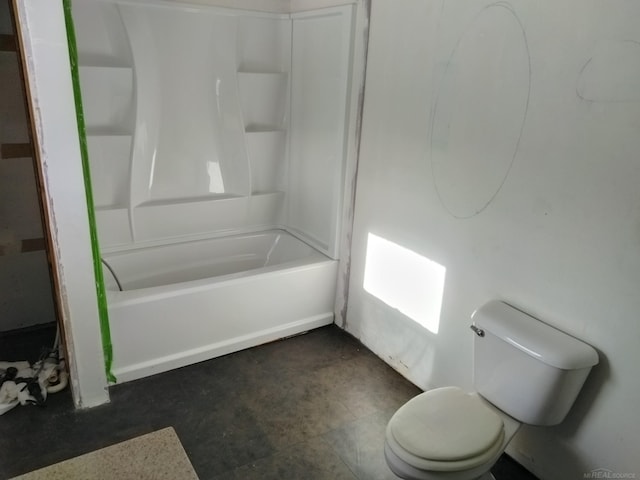 bathroom featuring shower / tub combination and toilet