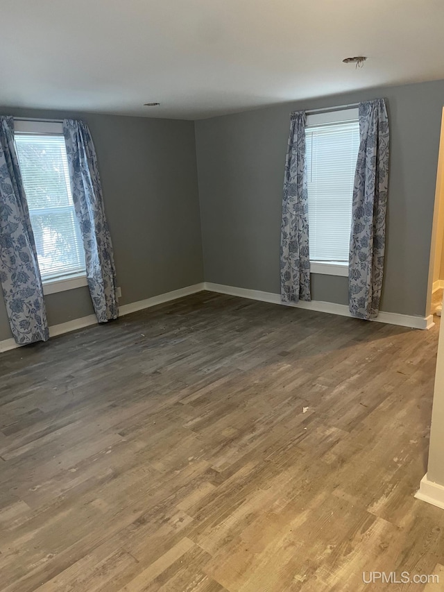 empty room featuring hardwood / wood-style flooring