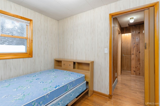 bedroom with wood finished floors