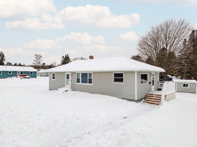 view of snow covered house