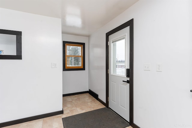 foyer entrance with baseboards