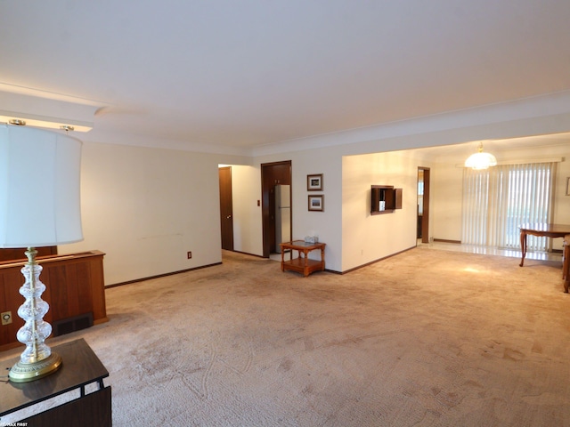 carpeted spare room with ornamental molding