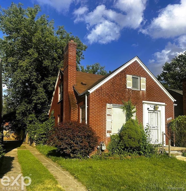 view of home's exterior featuring a yard