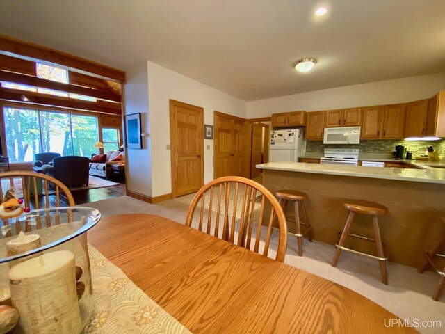 view of carpeted dining space