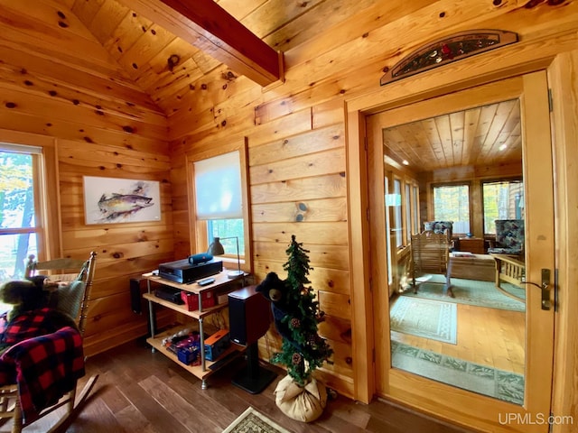 home office with dark hardwood / wood-style flooring, wood ceiling, and wood walls