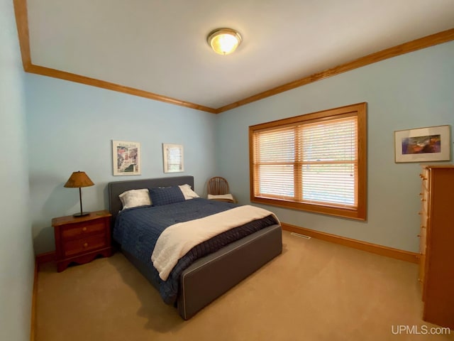 carpeted bedroom with crown molding