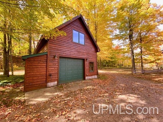 N10006 Shore Dr, Au Train, MI 49806 - staircase with wooden walls