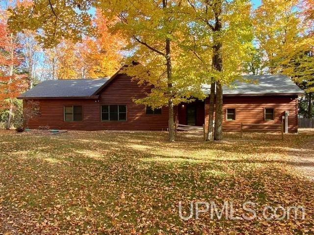 N10006 Shore Dr, Au Train, MI 49806 - rear view of house with a lawn