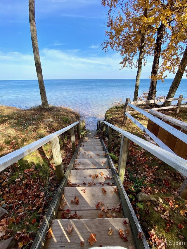 surrounding community featuring a water view