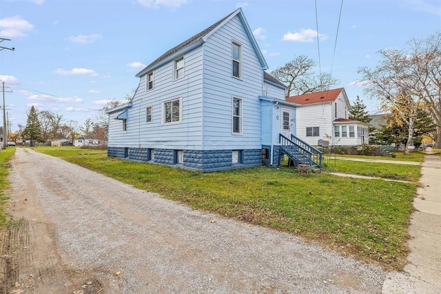 view of property exterior featuring a yard