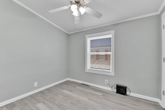 empty room with ceiling fan, ornamental molding, and light hardwood / wood-style flooring