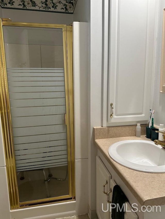 bathroom featuring vanity and walk in shower