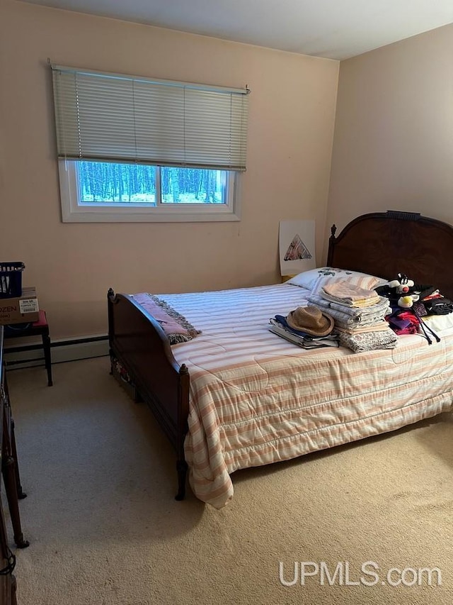 bedroom featuring carpet and a baseboard radiator